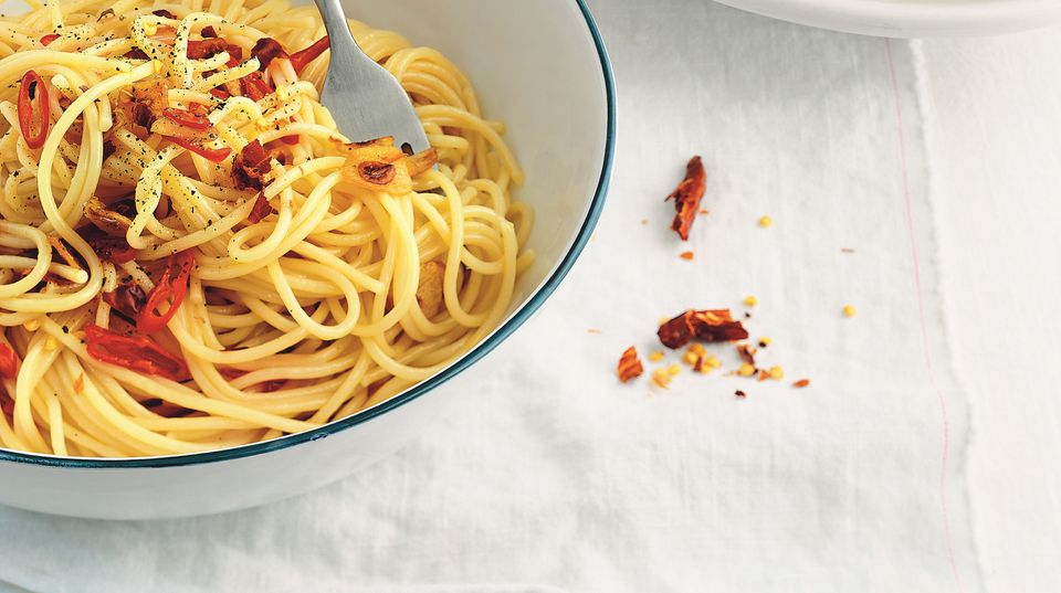 A plate of steaming pasta aglio e olio