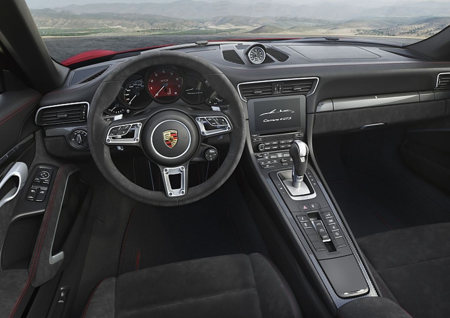 Im Cockpit erwartet den Fahrer die typische Porsche-Landschaft