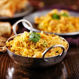 Biryani  Wo könnte dieses Reisgericht besser schmecken als in Indien: Gemüse, mariniertes Fleisch und die richtige Dosis an Gewürzen machen das Biryani perfekt.