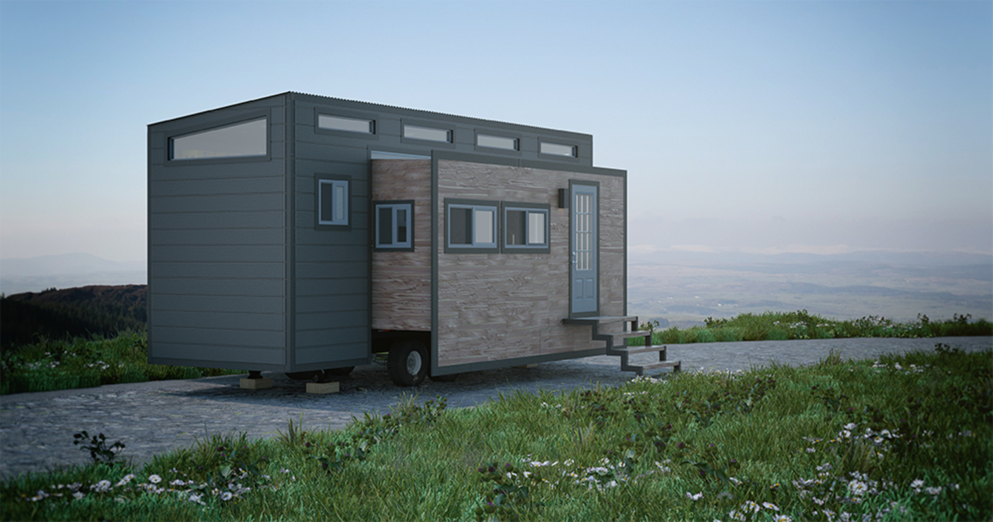 Modell Aurora Ein Tiny House steht in idyllischer Kulisse