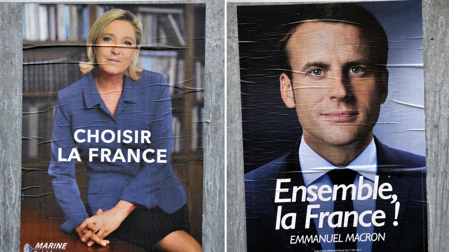 Wahlplakate von Marine Le Pen und Emmanuel Macron: Angela Merkel hat einen klaren Favoriten für die französische Präsidentschaft