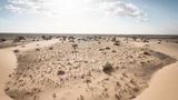 Düne bei North Hoor. Die Düne bedeckt nicht das ganze Land, aber das Bild zeigt doch den Klimawandel.