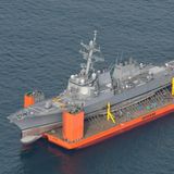 Dezember    Meer vor Japan. Der im Juni bei einer Kollision mit einem philippinischen Containerschiff beschädigte Zerstörer USS Fitzgerald der US-amerikanischen Marine wird an Bord eines Spezialtransportschiffes vom Hafen von Yokosuka (Japan) aus zur Reparatur in die USA gebracht.