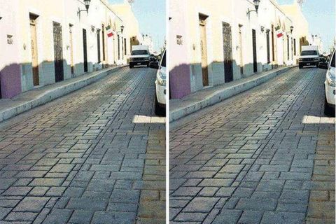 Die optische Täuschung zeigt eine Straße, im Hintergrund ist ein weißer Van zu sehen