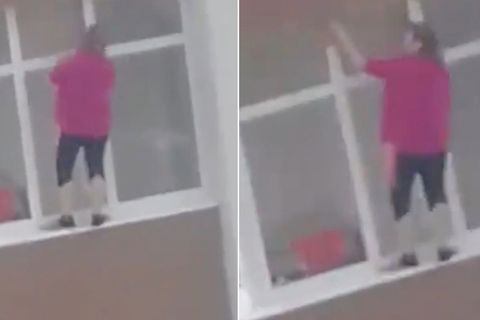 Angstlos an Häuserfassade: Diese Frau putzt Fenster in schwindelerregender Höhe