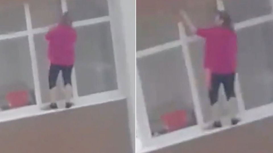 Angstlos an Häuserfassade: Diese Frau putzt Fenster in schwindelerregender Höhe Angstlos an Häuserfassade: Diese Frau putzt Fenster in schwindelerregender Höhe