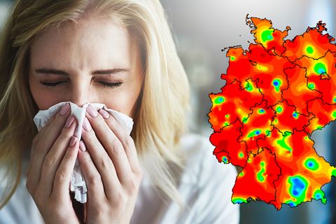 Eine Frau benutzt ein Taschentuch