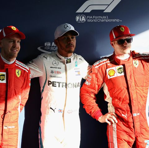 Formel-1-Fahrer Lewis Hamilton (M.), Kimi Raikkonen (r.)  und Sebastian Vettel