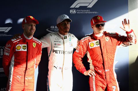 Formel-1-Fahrer Lewis Hamilton (M.), Kimi Raikkonen (r.)  und Sebastian Vettel