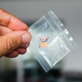 LSD Pappe in Plastik verpackt