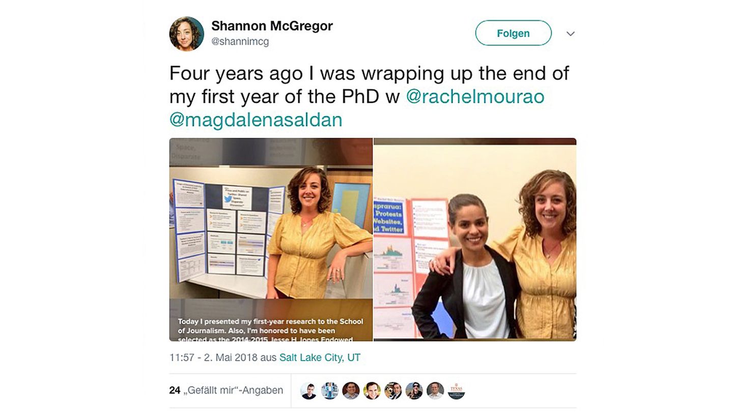Shannon McGregor in gelber Bluse vor Präsentationsplakat