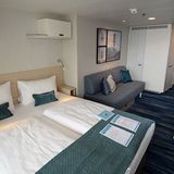 Mit 1447 Kabinen ist die "Eins" das Schiff in der Flotte von Tui Cruises mit den größten Passagierkapazität. Im Bild eine klassische Balkonkabine mit 17 Quadratmetern Wohnfläche und der zusätzlichen Bettcouch für eine dritte Person.
