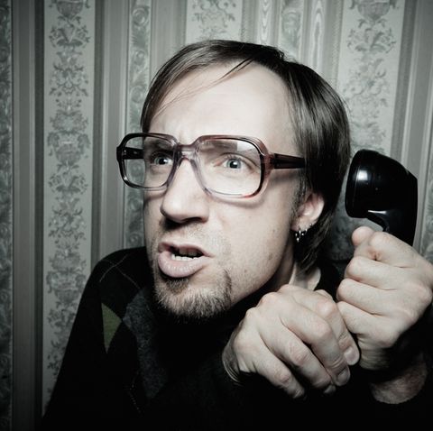 Mann mit Telefon in der Hand
