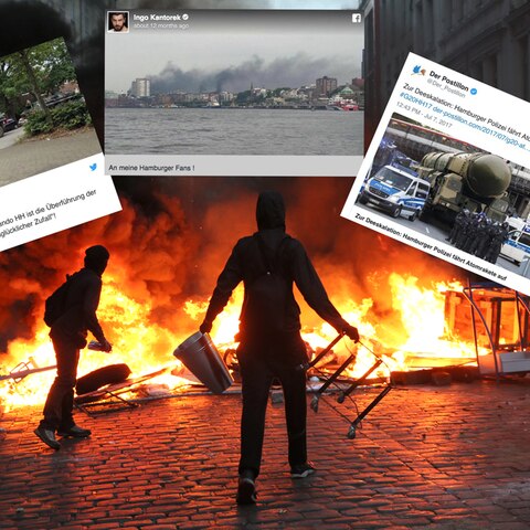 G20-Randalierer stehen in der Hamburger Sternschanze vor einer brennenden Barrikade