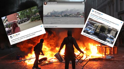 G20-Randalierer stehen in der Hamburger Sternschanze vor einer brennenden Barrikade
