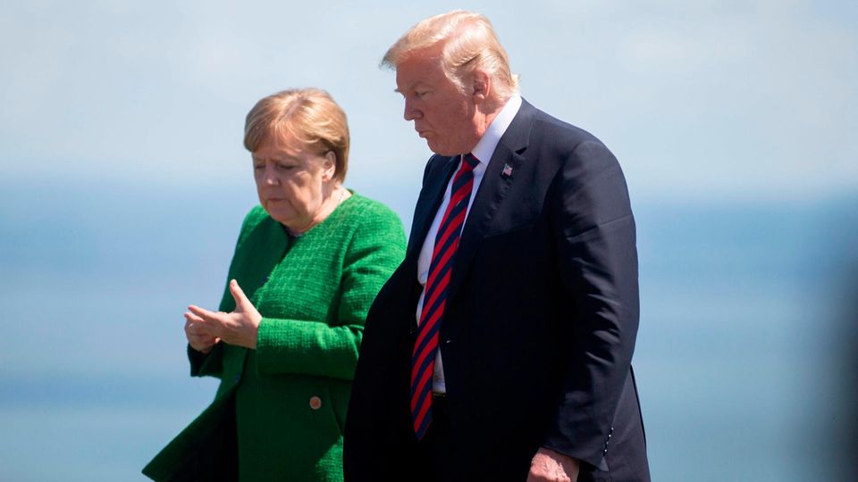Donald Trump und Angela Merkel während des G7-Treffens in Kanada