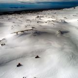 Schneemobil-Tour auf dem Eyjafjallajökull-Gletscher: Im Hintergrund liegen die Westmännerinseln
