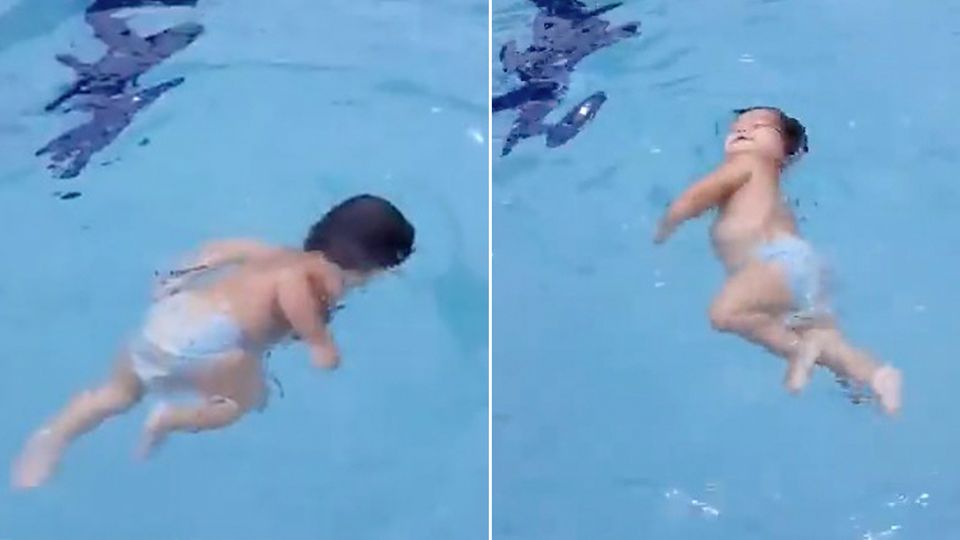 Ganz allein im Pool: Einjähriges Mädchen schwimmt allein zum Beckenrand und zieht sich aus dem Wasser