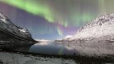 Dieses Polarlicht über dem Grotfjord zeigt sich in den schönsten Pastellfarben Dieses Polarlicht über dem Grotfjord zeigt sich in den schönsten Pastellfarben