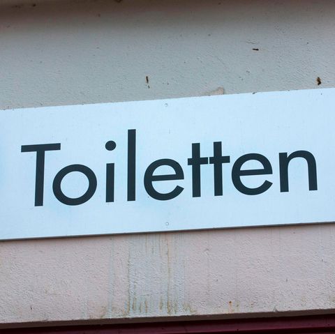 Putzmann: Schild einer öffentlichen Toilette