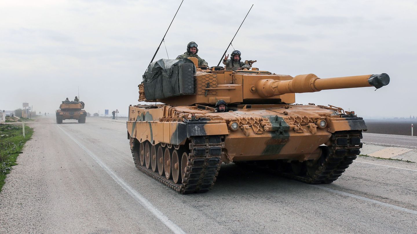 A Leopard 2A4 drives on a Turkish road near the Syrian border