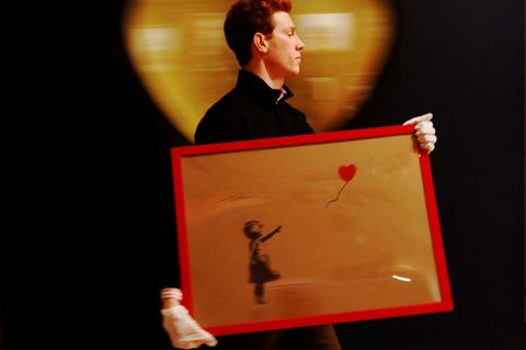 "Mädchen mit Luftballon" ist eins der bekanntesten Werke des Streetartkünstlers Banksy.