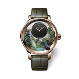 Kategorie Metiers D'Art      Gewinner: Tropical Bird Repeater von Jaquet Droz  Das Perlmuttzifferblatt - per Hand graviert und bemalt - und die Zeitanzeige aus schwarzem Onyx sowie die klangvolle Minutenrepitition sind längst nicht alles. Denn vom Pfau, der seine Schwanzfedern auffächert, über rauschende tropische Blätter bis zum fliegenden Kolibri ist dieser U(h)rwald mechanisch animiert.  Das sagt die Jury: "Sieben mechanische Animationen die bis zu zwölf Sekunden andauern und vier Szenarien bespielen - muss man mehr sagen? Eine Meisterleistung der großen Komplikation und Minutenrepetition, aufgeführt als exotisches Panoptikum, das zum Hinfort-Träumen einlädt."  Basisdaten (Auszug): Rotgold (Gehäuse), 47mm Durchmesser, wasserdicht bis 0m, 60 Stunden Gangreserve.  Preis: circa 669.400 Euro.