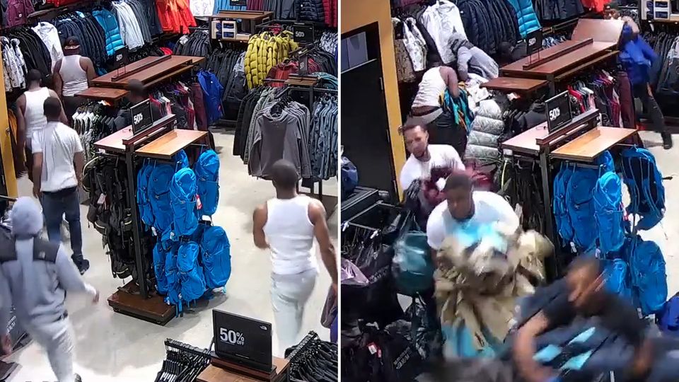 Zehn Männer gehen seelenruhig in einen Laden, dann reißen sie plötzlich die Waren aus den Schränken