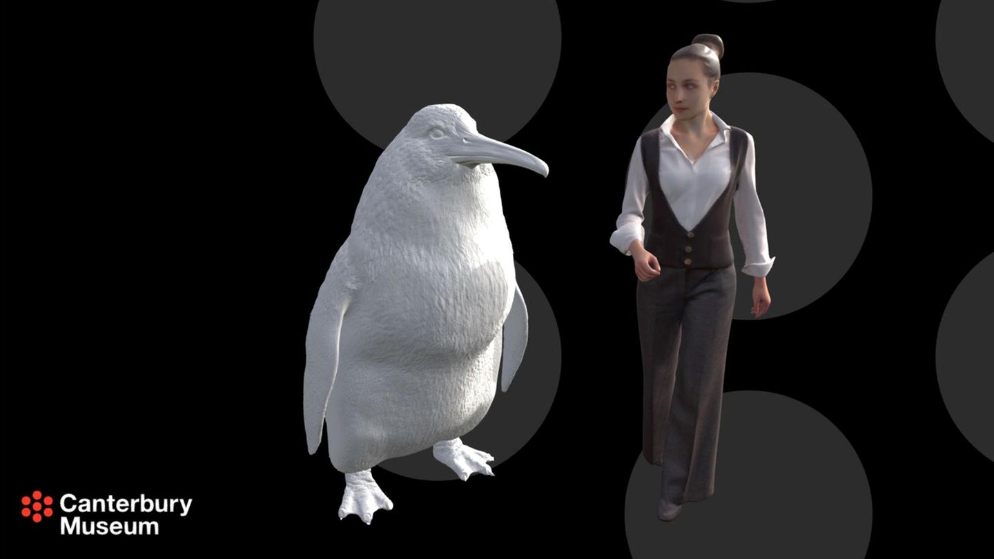 Menschengroßer Pinguin neben einer animierten Frau