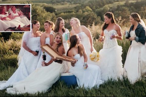 Acht Frauen in Brautkleidern lachen beim Pizzaessen – in den Händen halten sie Bierdosen.