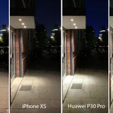 Nun treten die beiden iPhones (11 Pro und XS) gegen das Huawei P30 Pro an - einmal in der Automatik, einmal im dedizierten Nachtmodus. Auch hier fällt auf, dass das XS deutlich weniger Details aufnimmt, erkennbar an den Löchern in der Decke des Vordachs oder am Mauerwerk. Zwar erkennt man im Nachtmodus des P30 Pro mehr Details im schattigen Bereich der Straße, allerdings geht dadurch die nächtliche Stimmung flöten. Der Detailgrad des iPhone 11 Pro ist höher als beim P30 Pro, dafür ist der Himmel beim Huawei-Smartphone deutlich dunkler - ein Detail, das wir noch häufiger sehen werden. Man erkennt allerdings auch anhand des beleuchteten Gehwegs im Hintergrund, dass das iPhone mehr Licht einfängt.