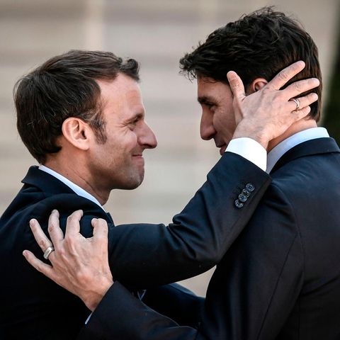 Emmanuel Macron (L) bids farewell to Canadian Prime Minister Justin Trudeau