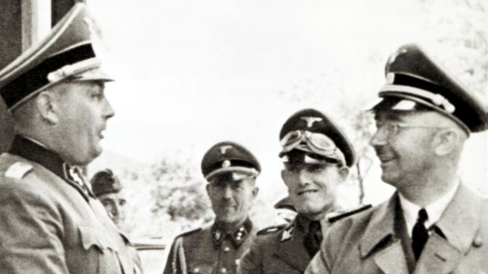 Rudolf Höß (left), the commander of Auschwitz, welcomes Reichsfuhrer SS Heinrich Himmler during a visit to the concentration camp