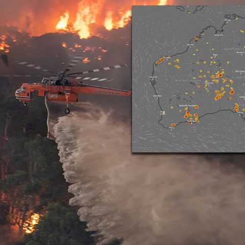 Löschflugzeug fliegt über brennenden Wald