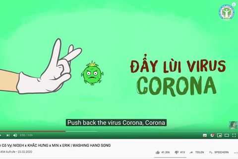 Ausschnitt aus Youtube. Eine Hand mit Handschuh schnippt den Coronavirus weg