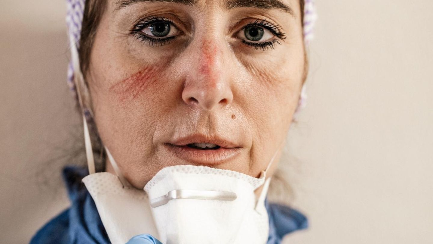 DOCTORS AND NURSES OF THE INTENSIVE CARE HOSPITAL, FIGHTING COVID-19 EMERGENCY IN PESARO - ITALY. THEY ARE PORTRAITED AT THE END OF THEIR LONG WORKSHIFT. 12 HOURS WITH NO DRINK AND NO TOILETBREAK, DUE TO THE PROTECTIVE SUIT THEY WEAR. THE SIGNS ON THEIR... Francesca Ruggeri