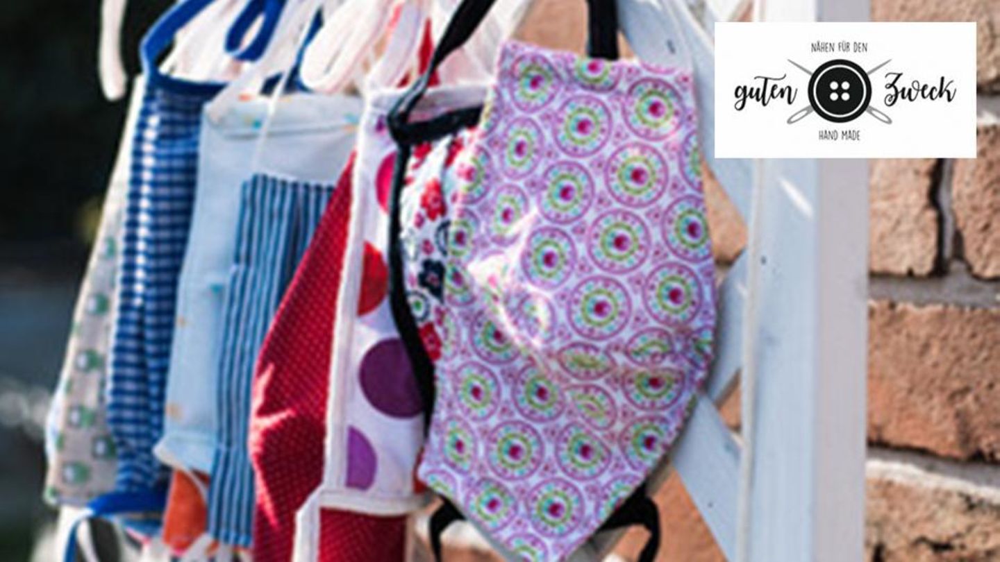 Bunte Mundschutzmasken hängen auf einer Leine. Oben rechts das Logo der Aktion: "Nähen für den guten Zweck" mit einem Knopf