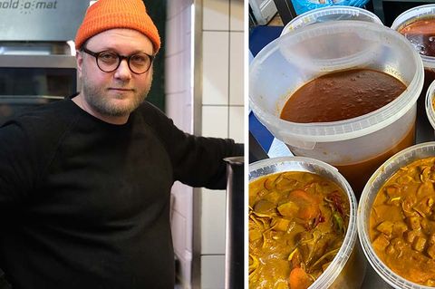 Der Koch Max Strohe neben Eimern voller Eintopf