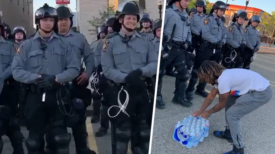Erfrischende Geste: US-Demonstrant versorgt Polizisten mit Wasser
