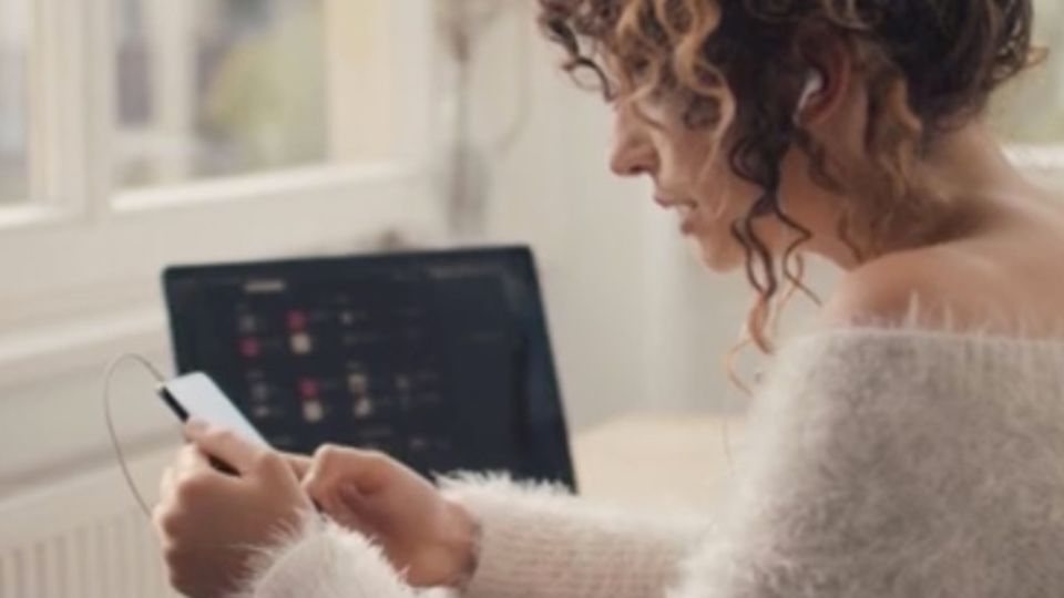Young woman is chatting over a video call on her smartphone Young woman is chatting over a video call on her smartphone