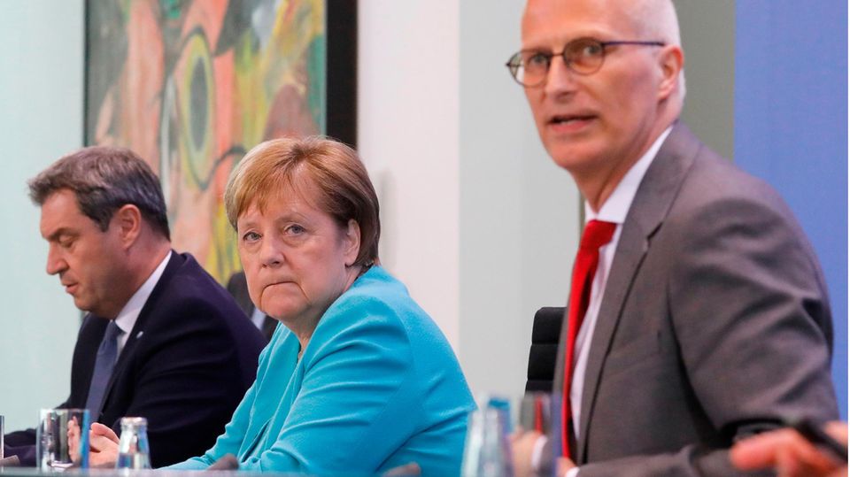 Markus Söder, Angela Merkel und Peter Tschentscher