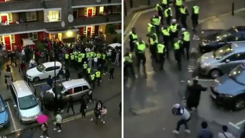 Rave-Teilnehmer bewerfen die Polizei mit Gegenständen im Londoner Stadtteil White City. Rave-Teilnehmer bewerfen die Polizei mit Gegenständen im Londoner Stadtteil White City.