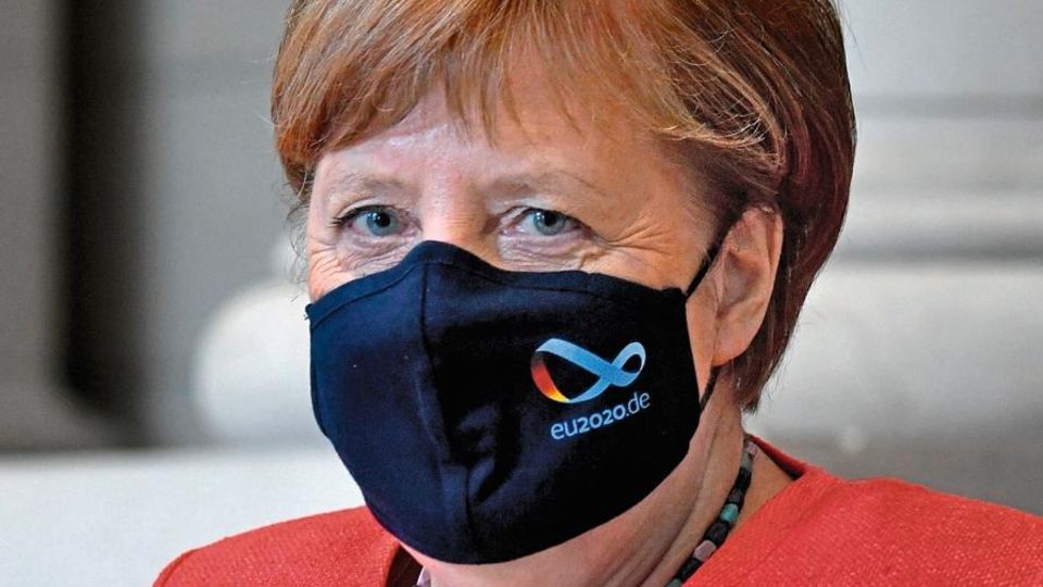 German Chancellor Angela Merkel wears a face mask with the logo of Germany's EU presidency as she leaves the German Federal Council (Bundesrat) after a speech on July 3, 2020 in Berlin. - Merkel gave a speech on the objectives of the German EU Coun... Angela Merkel