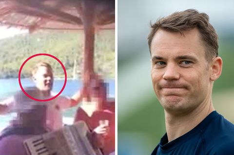Bayern-Torwart Manuel Neuer steht in blauem Pullover da und kneift die Lippen zusammen