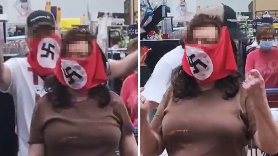 USA: Paar mit Hakenkreuz-Maske bei Walmart. USA: Paar mit Hakenkreuz-Maske bei Walmart.