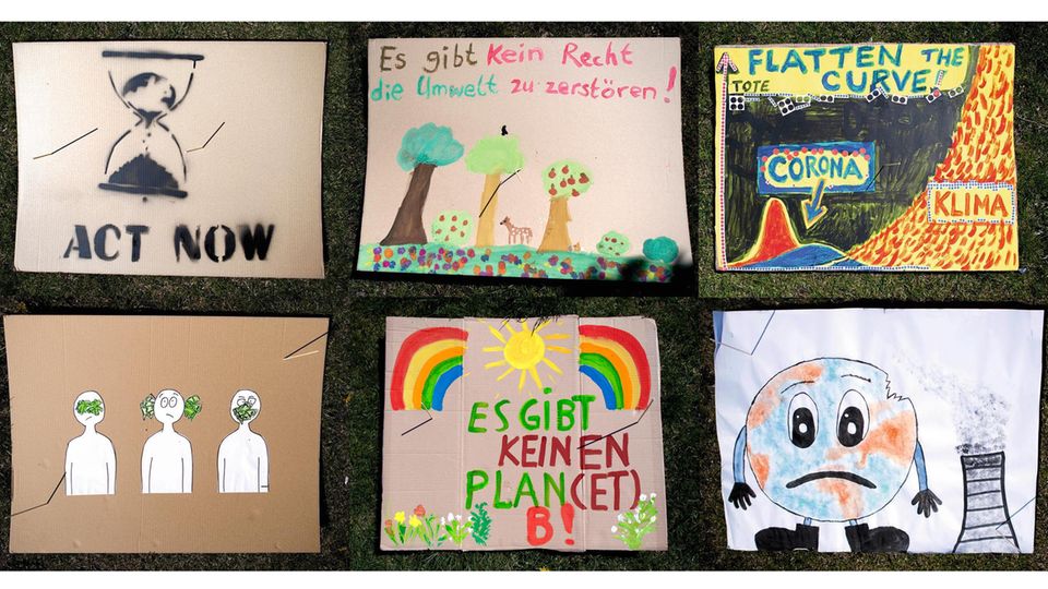 Selbst gemalte Pappschilder zum Thema Klimawandel Selbst gemalte Pappschilder zum Thema Klimawandel