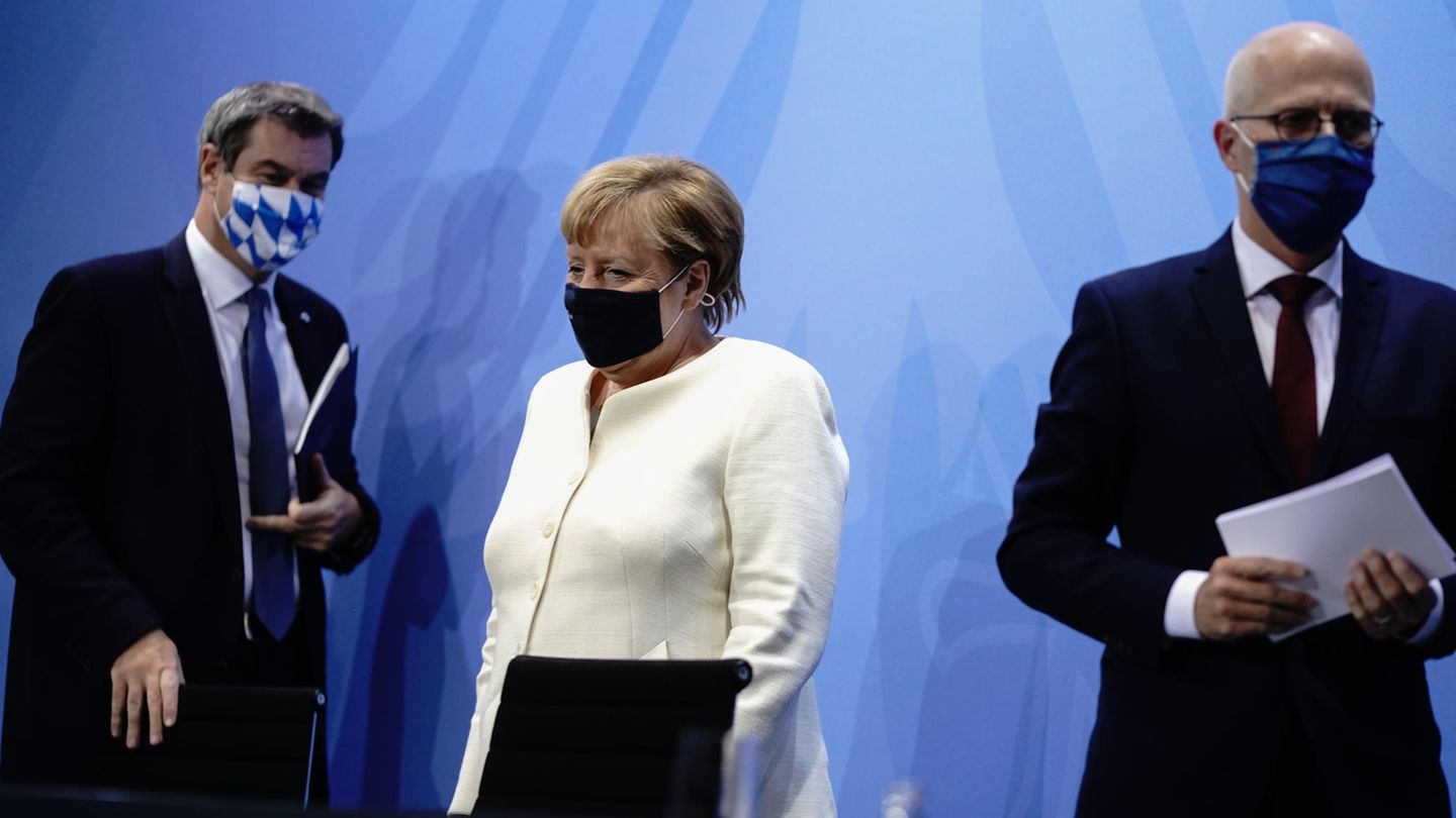 Von links: Markus Söder, Bundeskanzlerin Angela Merkel und Peter Tschentscher