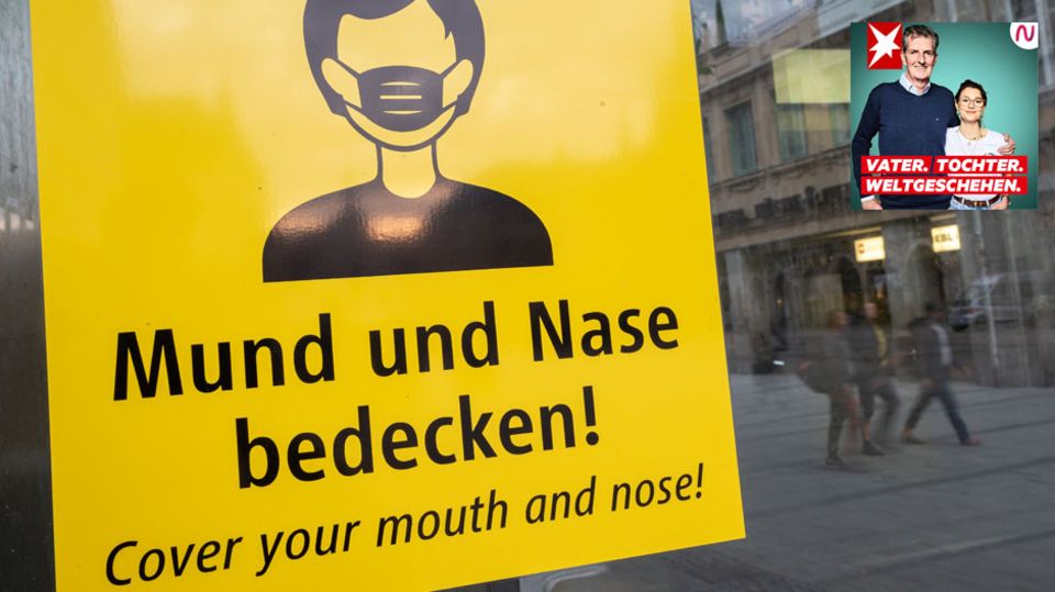Schild mit der Aufschrift: Mund und Nase bedecken