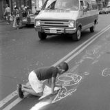 Boy writing OWL with chalk on street, Lower East Side, Manhattan, NYC, 1978