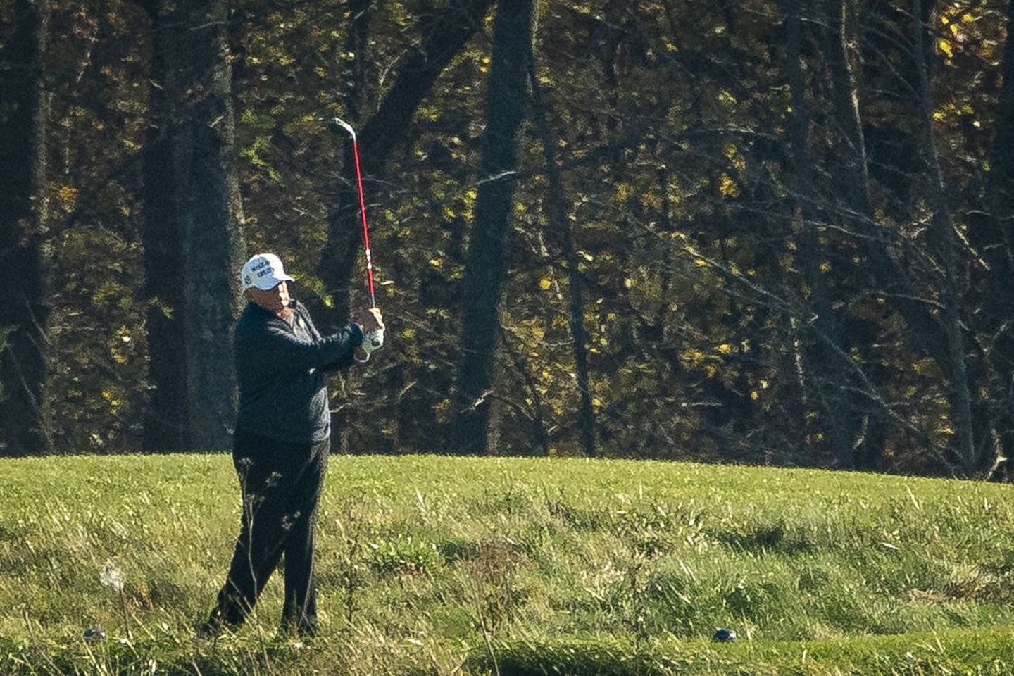 Donald Trump playing golf.